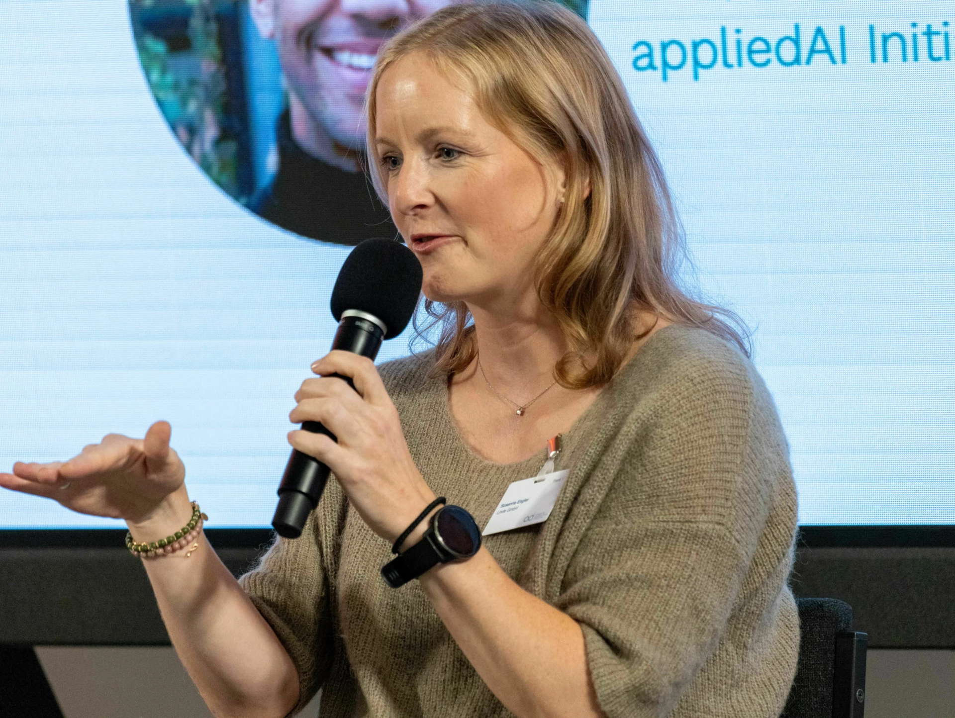 Woman giving a talk at AI conference